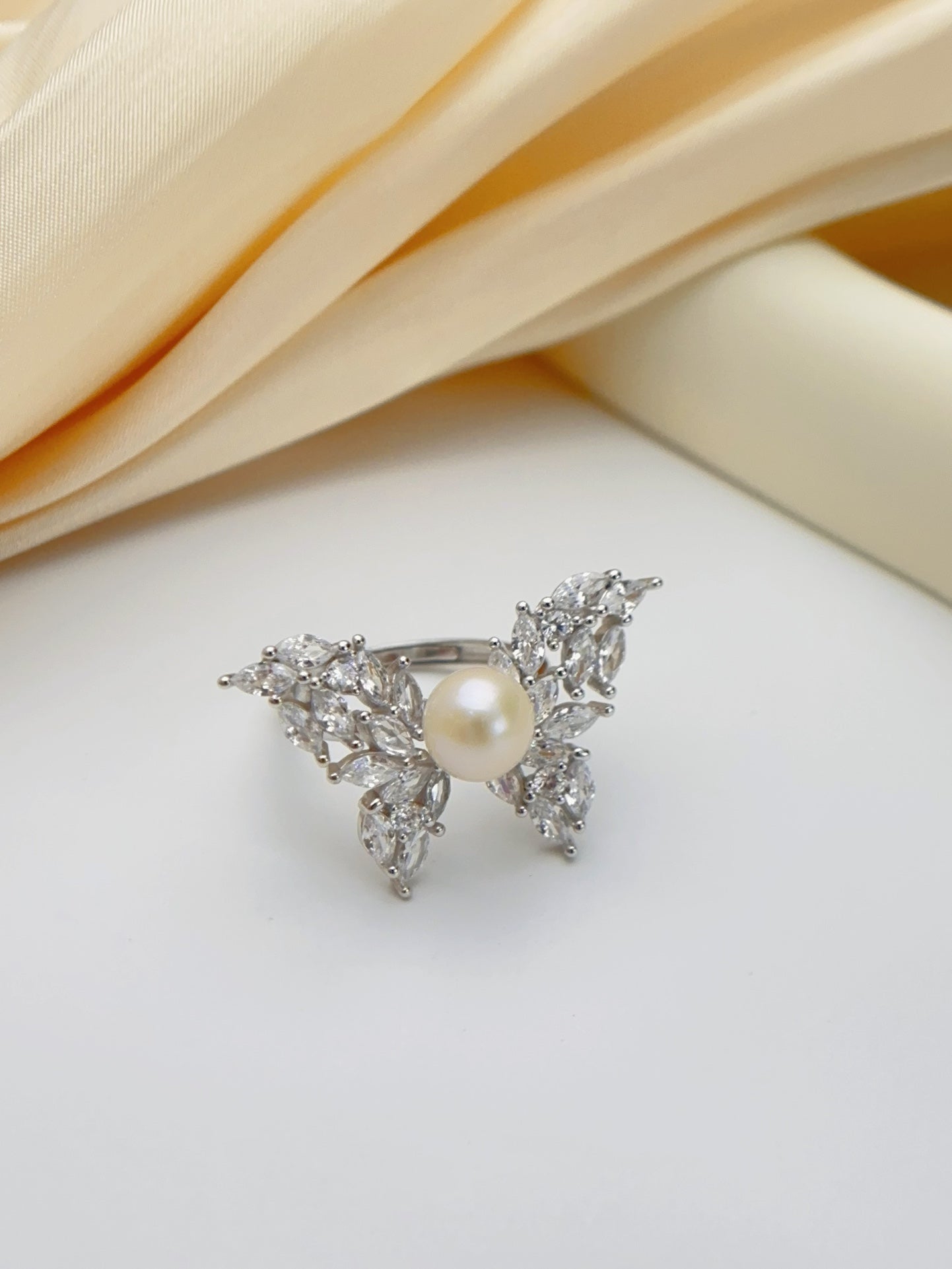 Whispering Wings · Pearl & Zircon Ring